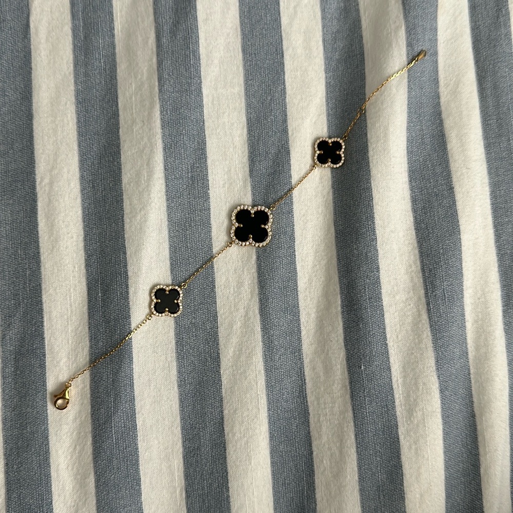 Dainty bracelet with black flowers and rhinestone detailing